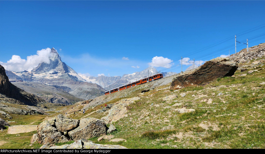 A train of the Gornergrat Railway with the Matterhorn in the back ground